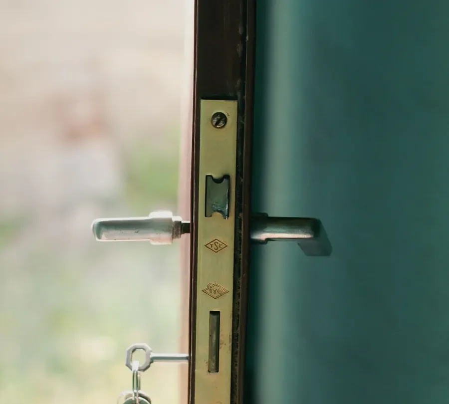 Door edge with a lock faceplate, lever handles and key – checking the multipoint mechanism before you change a uPVC door lock in Hastings, Locksmith Hastings guide