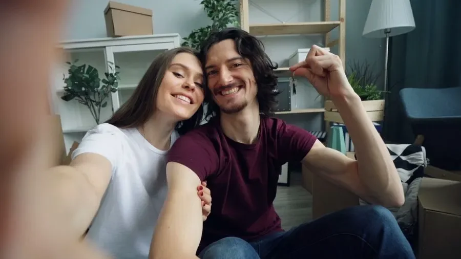 Couple holding up keys in their new home – residential locksmith Hastings help for homeowners from Locksmith Hastings