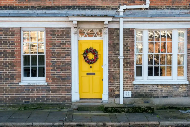 Types of door locks in the UK – yellow front door on a red-brick Victorian house in Hastings, Locksmith Hastings guide to identifying your lock